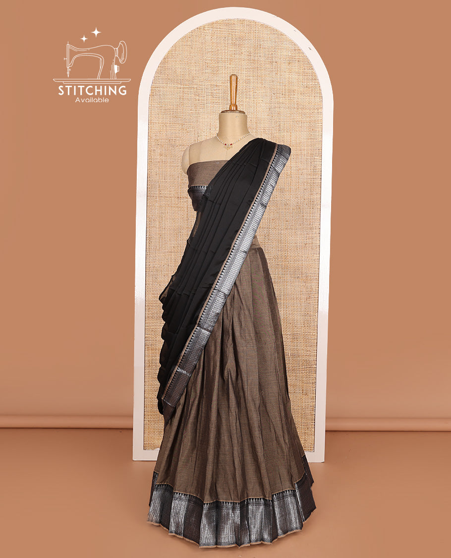 Brown cotton half-saree, plain with contrast traditional design steeped border skirt, matching blouse, and contrast bordered dhavani