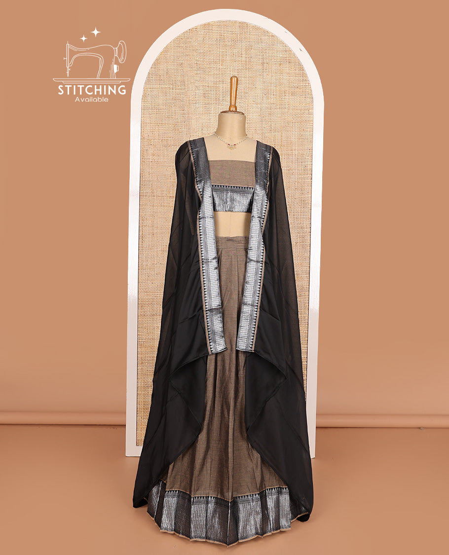 Brown cotton half-saree, plain with contrast traditional design steeped border skirt, matching blouse, and contrast bordered dhavani