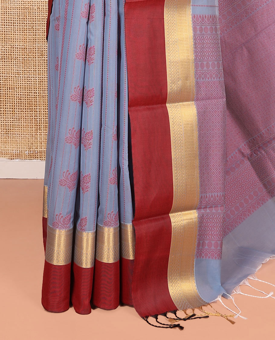 Grey Semi-Silk Cotton Saree, Sparsely Threaded with Buttas and Stripes All Over Its Body, Complemented by a Contrast Border of Traditional Zari Designs, Pallu of Jaal Designs, and Paired with a Matching Blouse