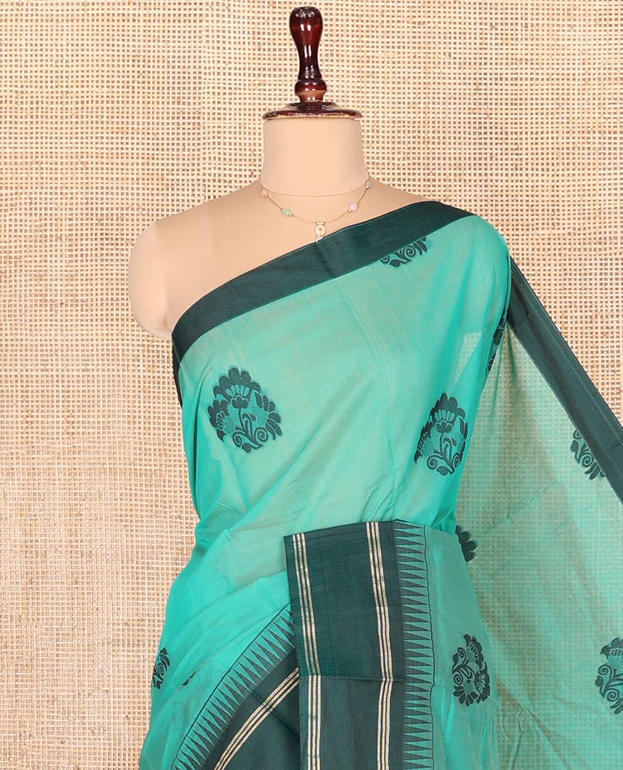 Blue Semi-Silk Cotton Saree, Prettified with Floral Buttas on Its Body, Complemented by Contrast Temple Border, Pallu of Floral Designs, and Paired with a Matching Blouse