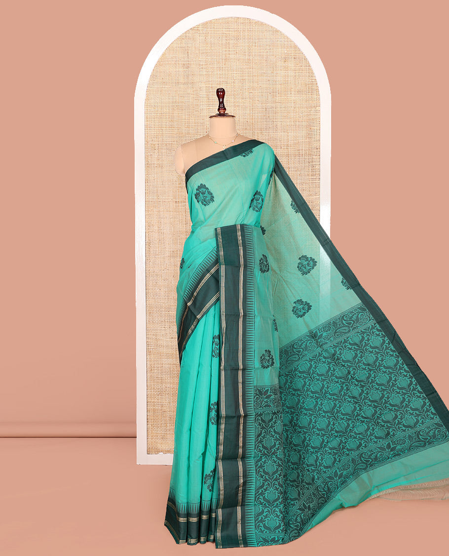 Blue Semi-Silk Cotton Saree, Prettified with Floral Buttas on Its Body, Complemented by Contrast Temple Border, Pallu of Floral Designs, and Paired with a Matching Blouse