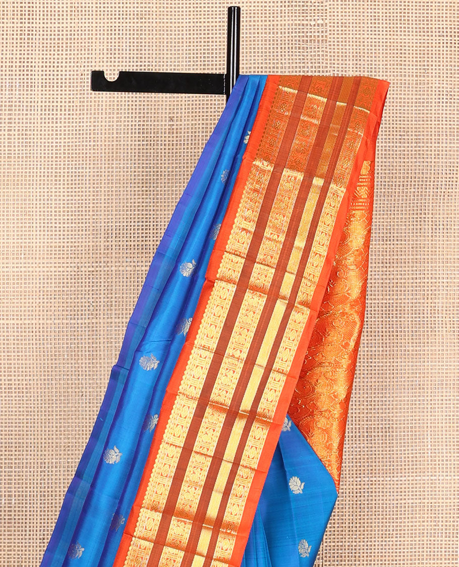 Blue buttas Kanchipuram silksaree, contrast one-sided korvai border of thilakam mokku,neli,rudraksham,mayil & banaras & manga motifs pallu