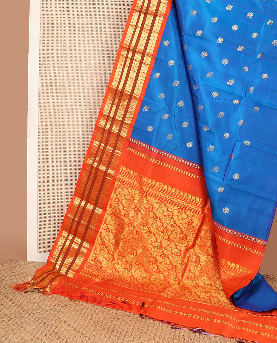 Blue buttas Kanchipuram silksaree, contrast one-sided korvai border of thilakam mokku,neli,rudraksham,mayil & banaras & manga motifs pallu