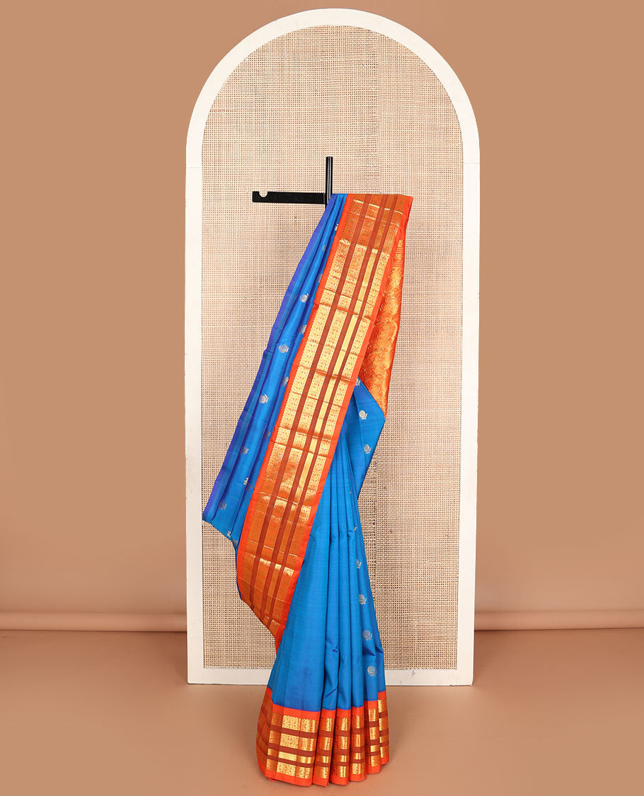 Blue buttas Kanchipuram silksaree, contrast one-sided korvai border of thilakam mokku,neli,rudraksham,mayil & banaras & manga motifs pallu