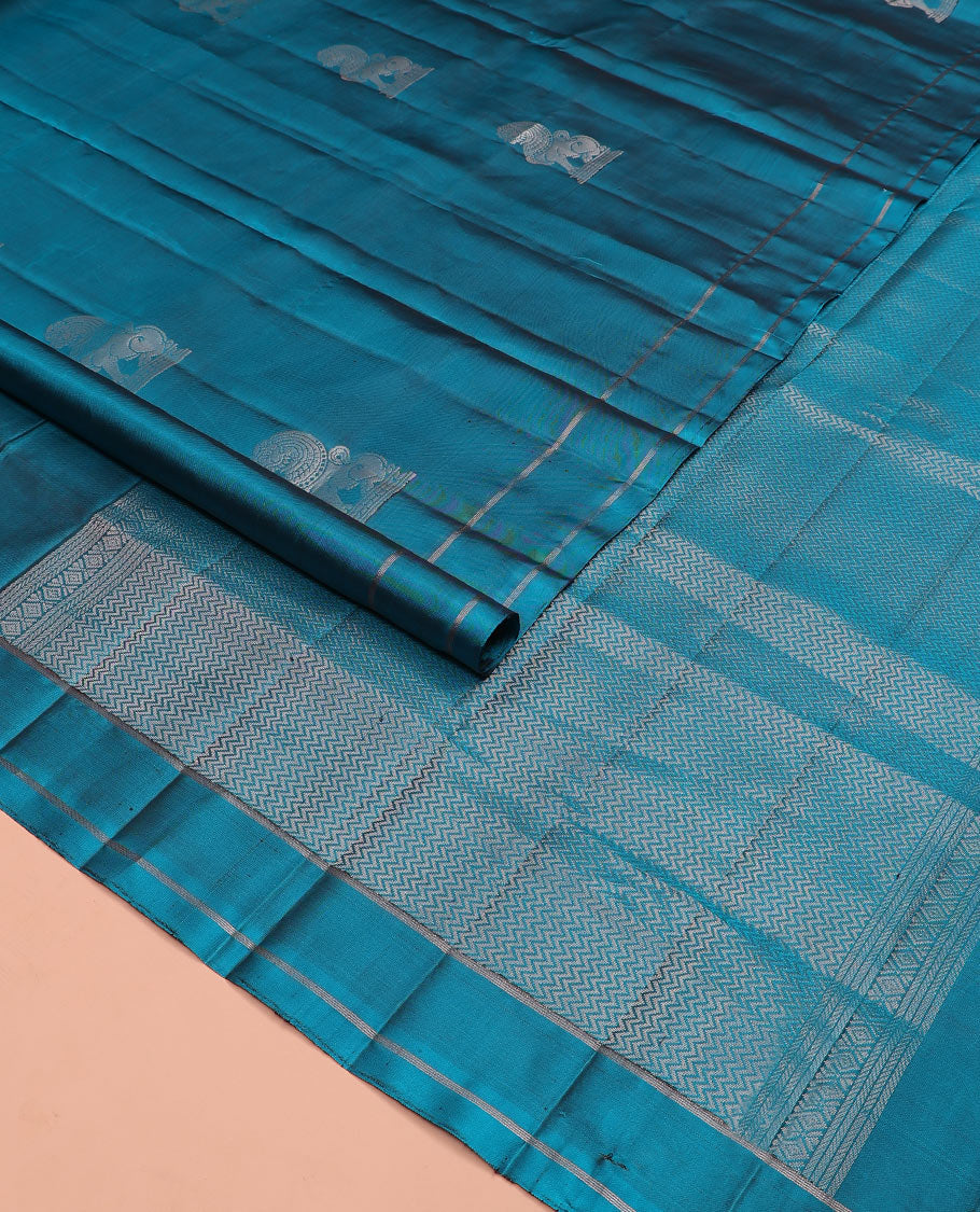 Blue singam buttas soft silk saree, zari striped border, and pallu of vanki designs
