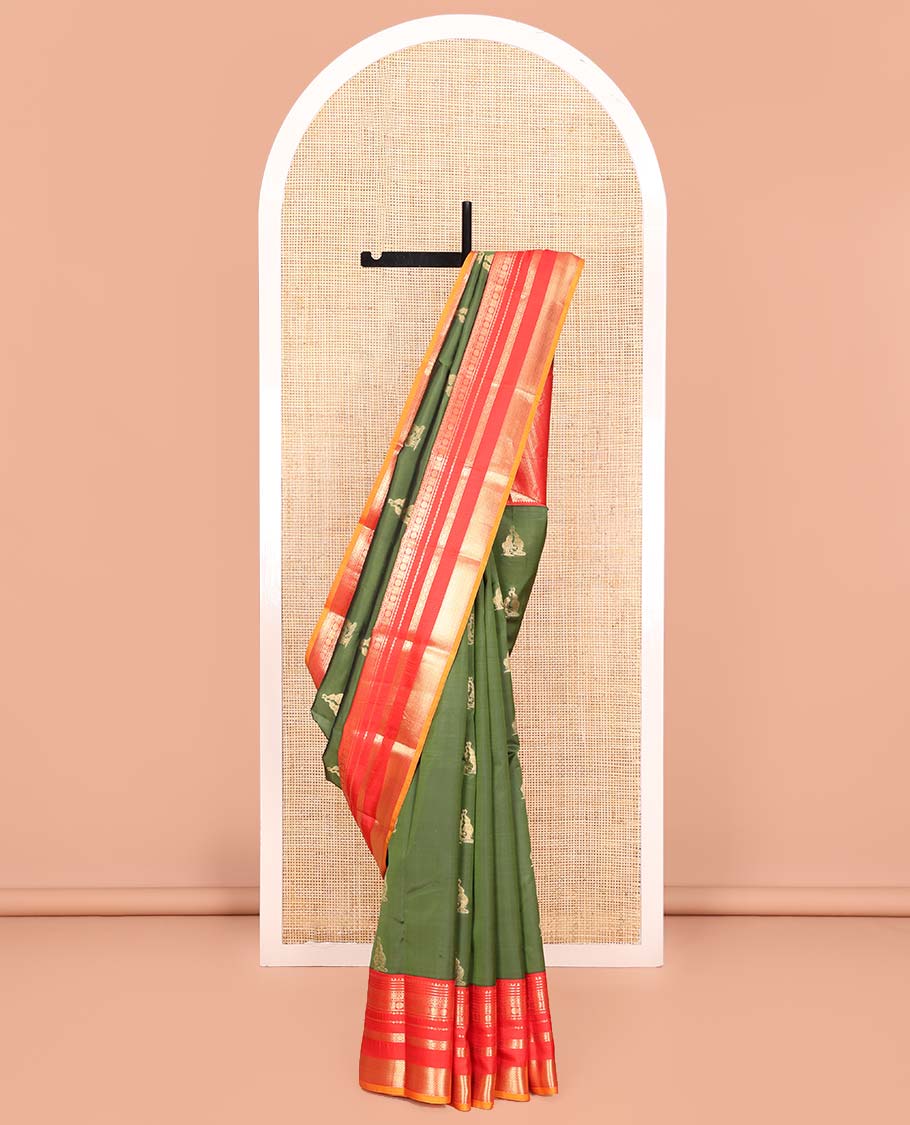 Green Vasundhara Lite Silk Mix Saree, Highlighted by Yaanai Buttas, Complemented by a Contrast Varisai Pettu Border of Rekku, Muthu, Jada Nagam, Mayil, Neli, Rudraksham, and Mayil Kann Design, Intricately Designed Pallu, and Paired with a Contrast Blouse