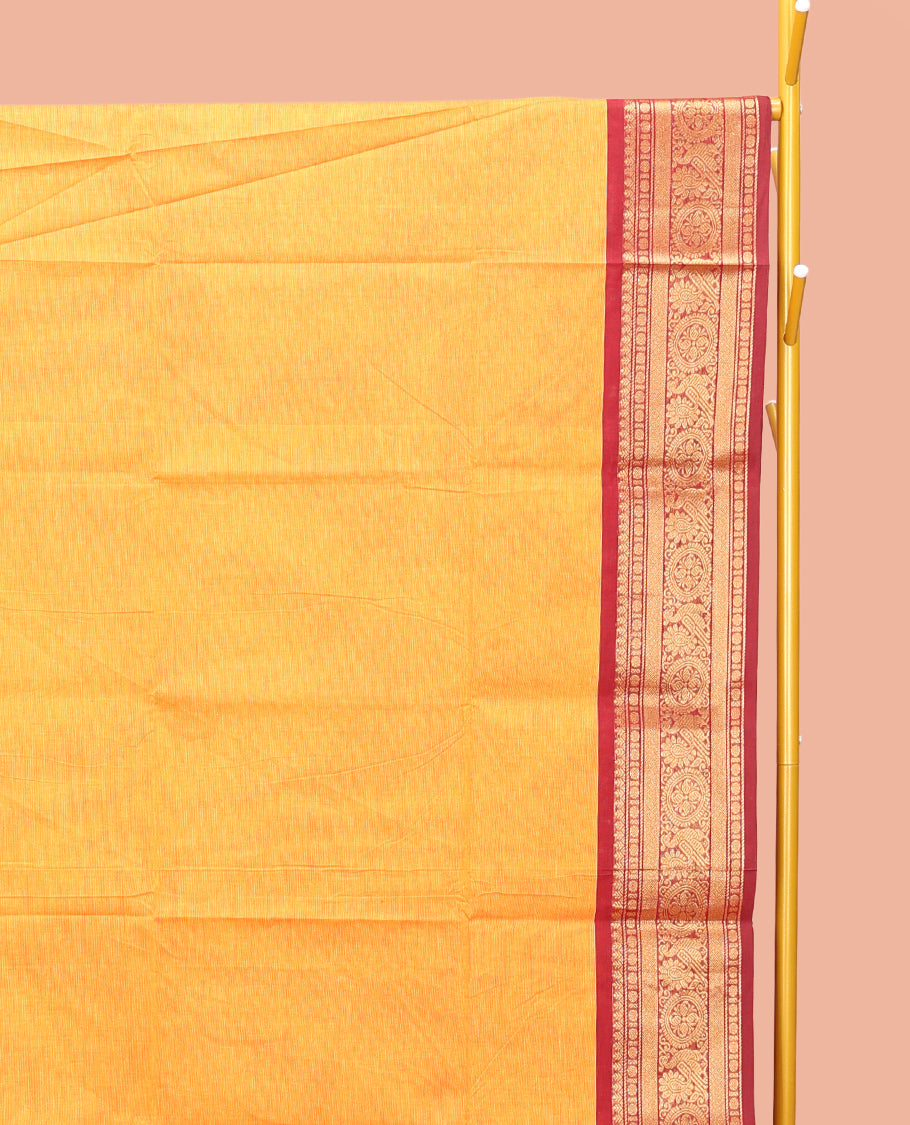 Orange Plain Chettinad Cotton Saree, Complemented by a Contrast Traditional Zari Design Woven Border, Subtle Pallu of Stripes, and Paired with a Matching Blouse