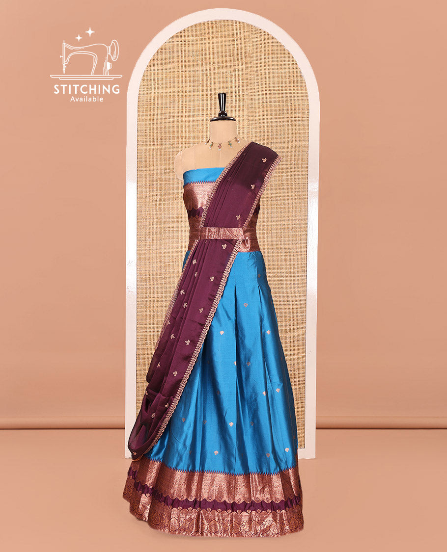 Blue-Purple Semi-Banarasi Half-Saree Mesmerized with Zari Buttas on Its Skirt, Complemented by a Contrast Traditional Zari Temple Rettai Pettu Border, Paired with a Matching Blouse, and a Satin Georgette Embroidered Scallop Dhavani