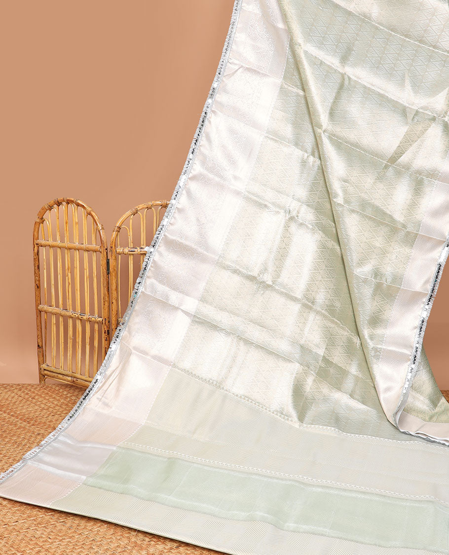 Light green jacquard tissue saree with self floral zari design border & intricate zari design pallu