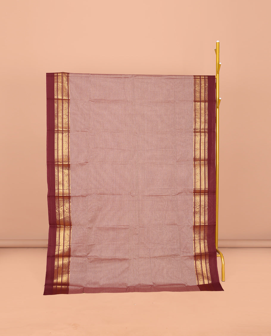 Pale Brown Plain Chettinad Cotton Saree, Complemented by Contrast Traditional Zari Design Kal Eragina Border of Paisleys, Striped Pallu, and Paired with Matching Blouse