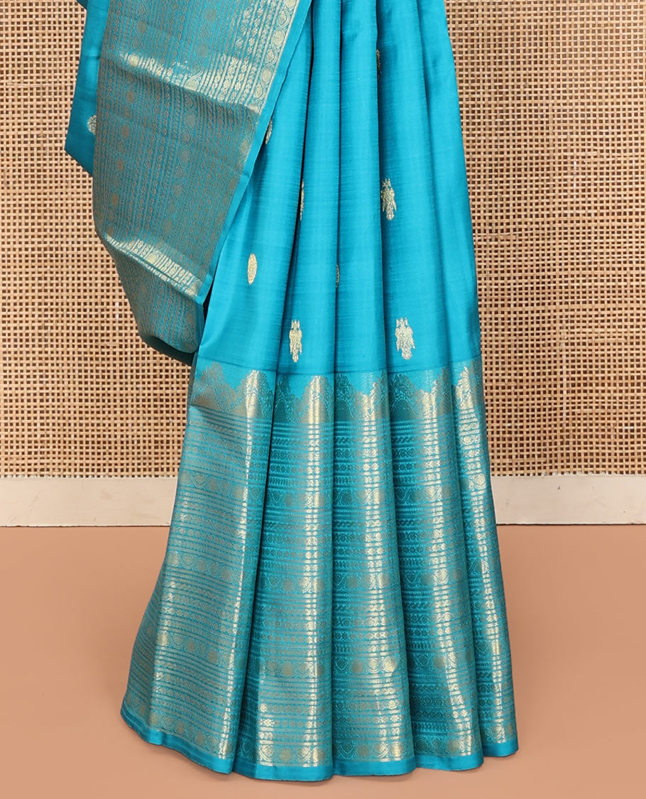 Blue Kanchipuram Silk Saree, Decorated with Iruthalai Pakshi Buttas All Over Its Body, Highlighted by a Zari Border of Puli Nagam, Manga, Kamalam, and Kodi Visiry Designs, Pallu of Human Figurines, and Paired with a Matching Blouse