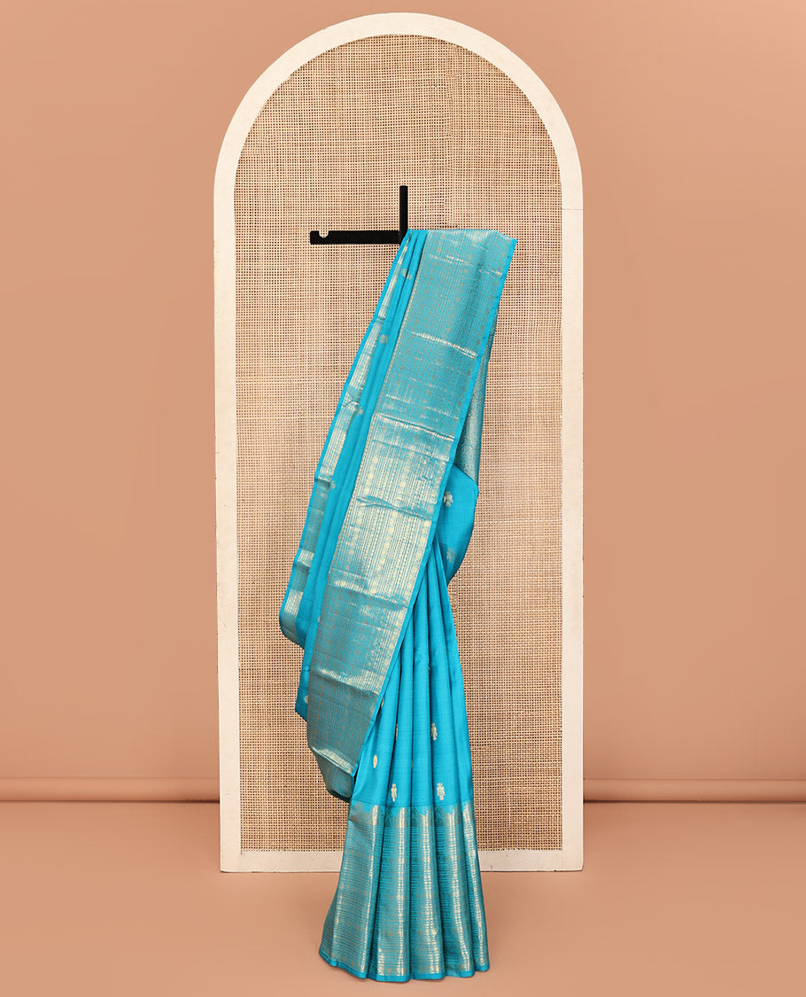 Blue Kanchipuram Silk Saree, Decorated with Iruthalai Pakshi Buttas All Over Its Body, Highlighted by a Zari Border of Puli Nagam, Manga, Kamalam, and Kodi Visiry Designs, Pallu of Human Figurines, and Paired with a Matching Blouse