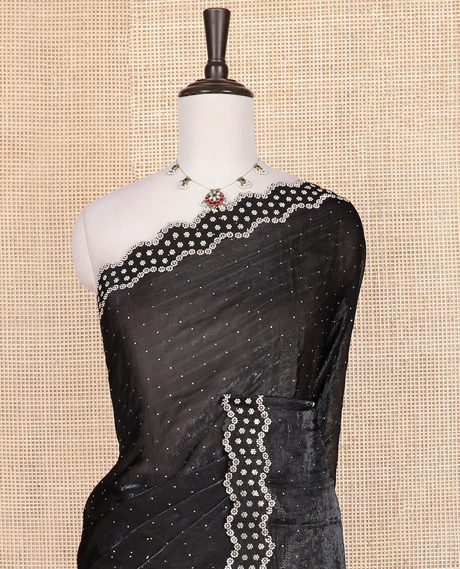 Black stone work designer saree, scallop floral motifs micro stone work border