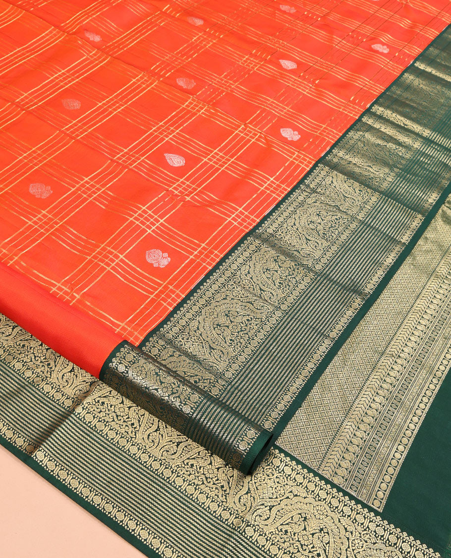 Orange Vasundhara Silk Saree Showcasing Zari Butta Enclosed Checks, Contrast Border of Muthu, Mayil, Rudraksham, and Banaras Designs, Jaal Pallu, and Contrast Blouse