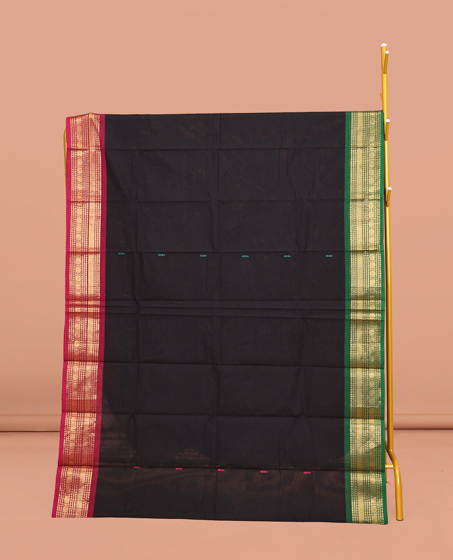 Black Chettinad Cotton Saree, Delicately Woven with Buttas All Over Its Body, Complemented by a Contrast Traditional Zari Design Woven Ganga-Jamuna Border, Pallu of Stripes, and Buttas, and Paired with a Matching Blouse