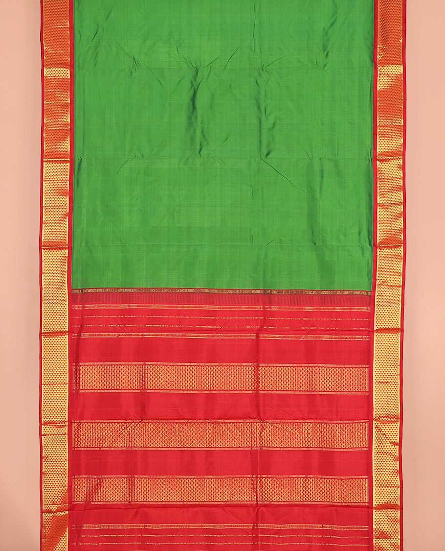 Parrot green plain nine-yard silk saree, contrast ara maadam design korvai border, and pallu of ara maadam designs