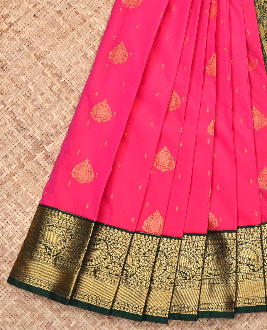 Rani Pink Budget Silk Saree, Gleamed Up with Zari Buttas All Over Its Body, Complemented by a Contrast Traditional Zari Design Border of Paisleys, Grand Pallu, and Paired with a Contrast Blouse