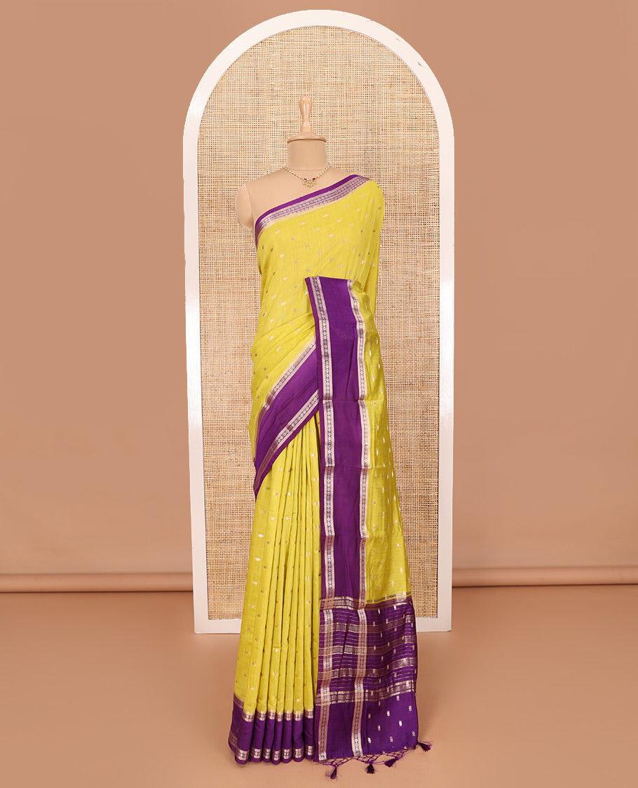 Elegant Yellow Assam Silk Saree Features Zari Buttas All Over the Body, Complemented by Contrast Traditional Zari Design Border, Pallu Elevated with Zari Stripes, and Paired with a Contrast Blouse