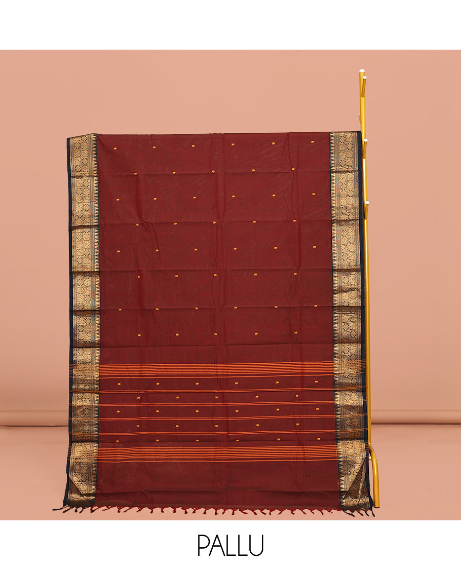 Maroon Chettinad Cotton Saree, Woven with Buttas All Over Its Body, Complemented by a Contrast Traditional Zari Design Woven Border, Pallu of Stripes, and Buttas, and Paired with a Matching Blouse