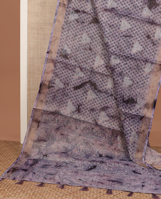 Light lavender shibori printed with leaf motifs, printed cotton saree, bavanji border, and floral design pallu