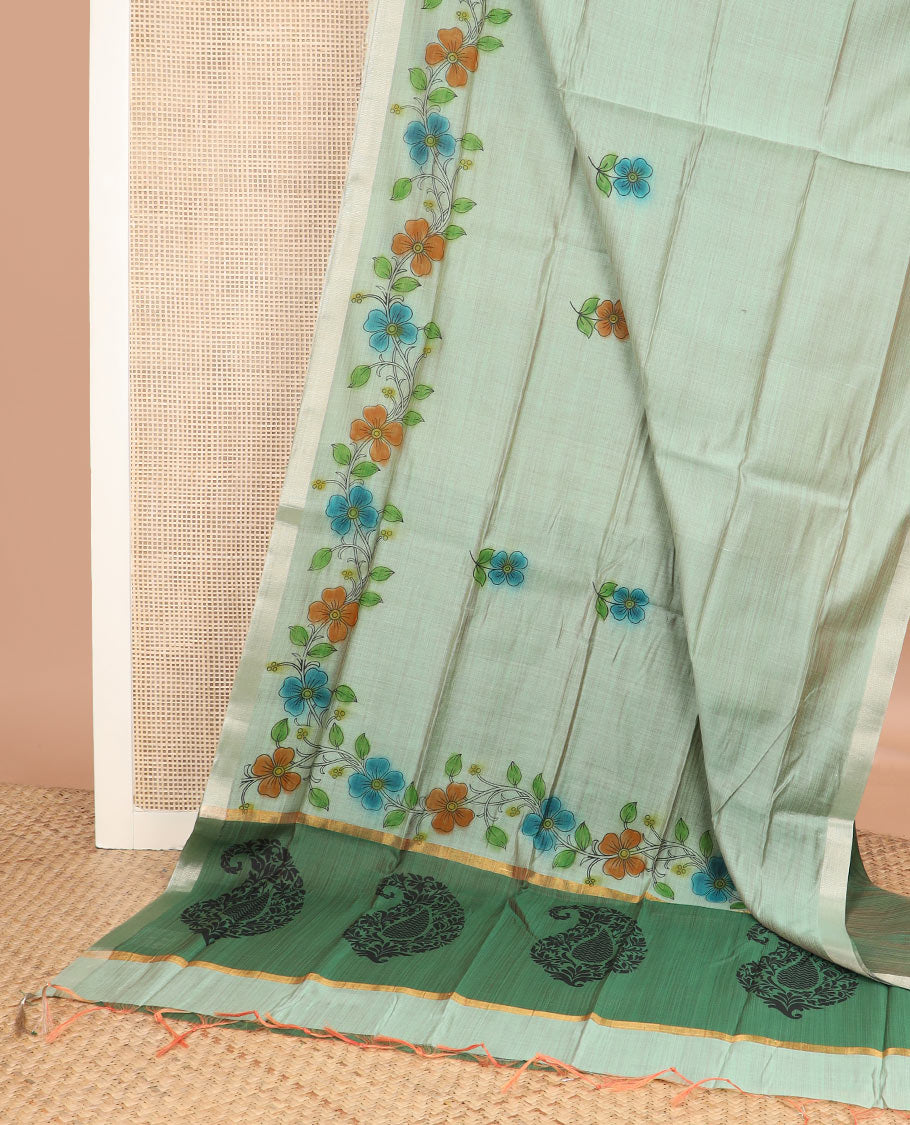 Pale green floral buttas printed chirala cotton saree, bavanji border, and contrast paisley print pallu
