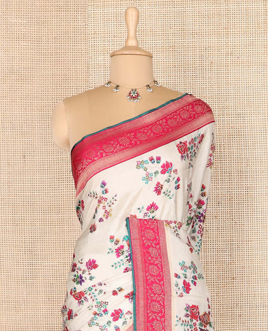 Cream meenakari floral motifs dola silk saree, contrast traditional zari border, and intricate pallu
