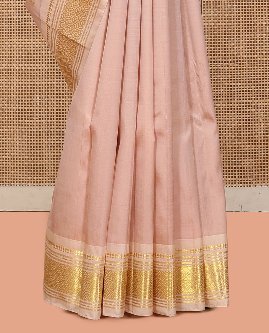Light Sandal Kanchipuram Silk Saree, Subtly Sparkled with Buttas, a Contrast One-Sided Border of Panner Sombu, Banaras, Muthu, and Jaal Designs, a Zari Design Pallu, and No Blouse
