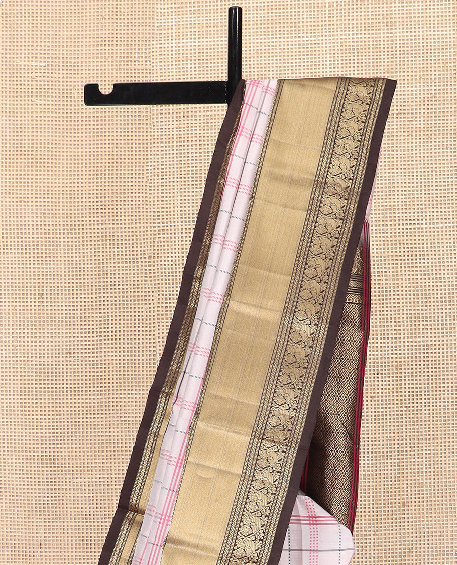 Off-White Kanchipuram Silk Saree Decked Up with Checks on Its Body, Complemented by a Contrast Border of Muthu and Mayil Designs, Majestically Detailed Pallu of Jaal Designs, and Paired with a Contrast Blouse