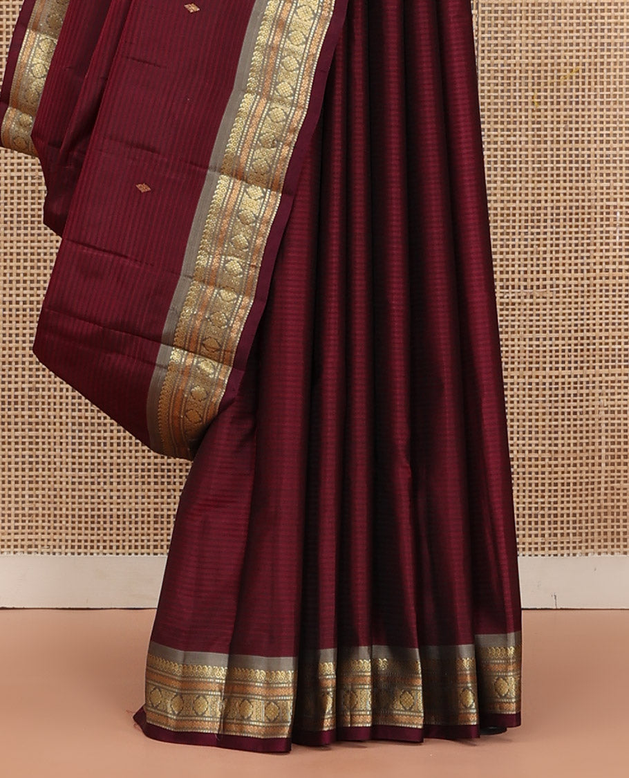 Maroon Kanchipuram Silk Saree Beautified with Vazhaipoo Stripes and Zari Buttas, Complemented by Contrast Border Featuring Manga Mokku, Muthu, Greek Key, and Laddu Kamalam Designs, Sparsely Zari Woven Pallu, and Paired with a Contrast Blouse