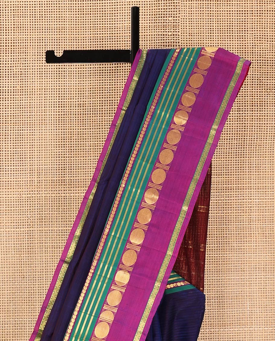 Blue Kanchipuram Silk Saree, Subtly Sparkled with Stripes All Over Its Body, Complemented by a Contrast Border of Manga, Banaras, Poun, and Rettai Neli Designs, Pallu of Zari Stripes, and Paired with a Contrast Blouse