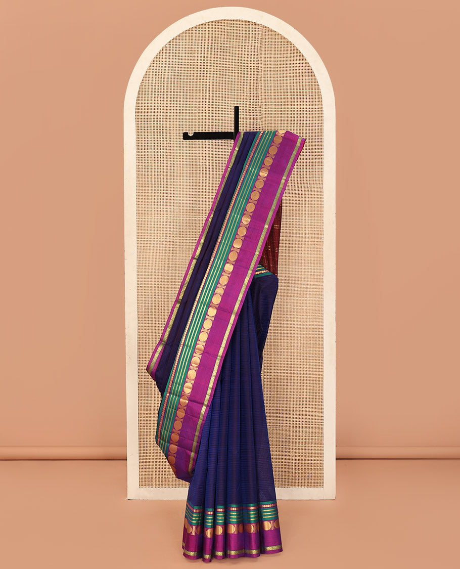Blue Kanchipuram Silk Saree, Subtly Sparkled with Stripes All Over Its Body, Complemented by a Contrast Border of Manga, Banaras, Poun, and Rettai Neli Designs, Pallu of Zari Stripes, and Paired with a Contrast Blouse