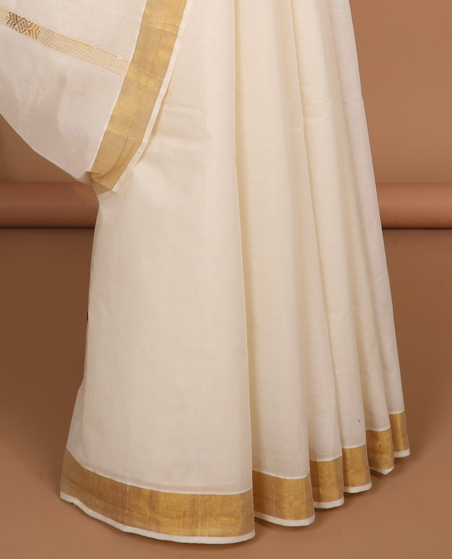 Cream kerala saree with zari designs, zari border & pallu of intricate designs