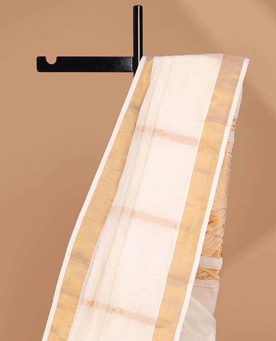 Cream kerala saree with zari stripes, plain border & pallu of peacock designs