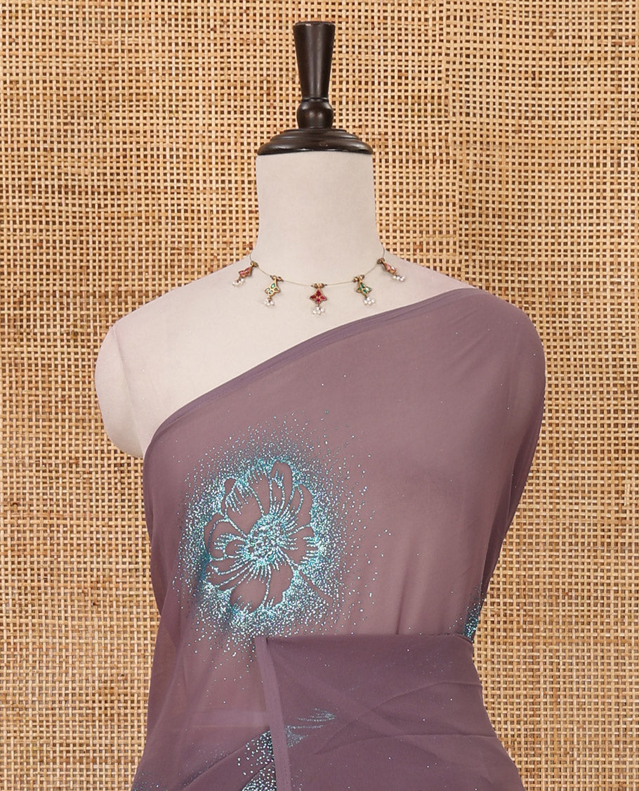 Borderless pastel lilac 60 gm georgette saree features floral vine designs, glitter embroidery work, contrast plain blouse