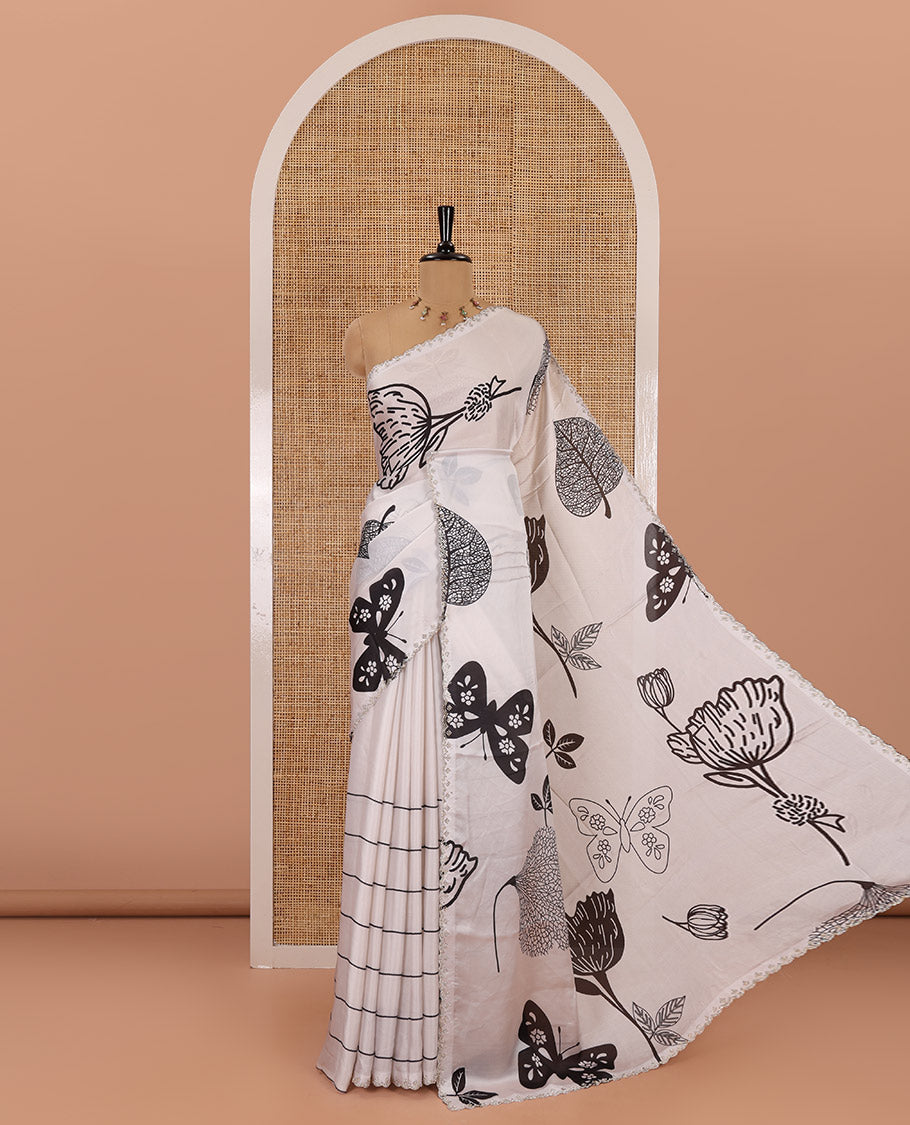 Cream and black floral, butterflies and horizontal striped printed satin crepe saree, stone work scallop border, and a contrast printed stone work blouse