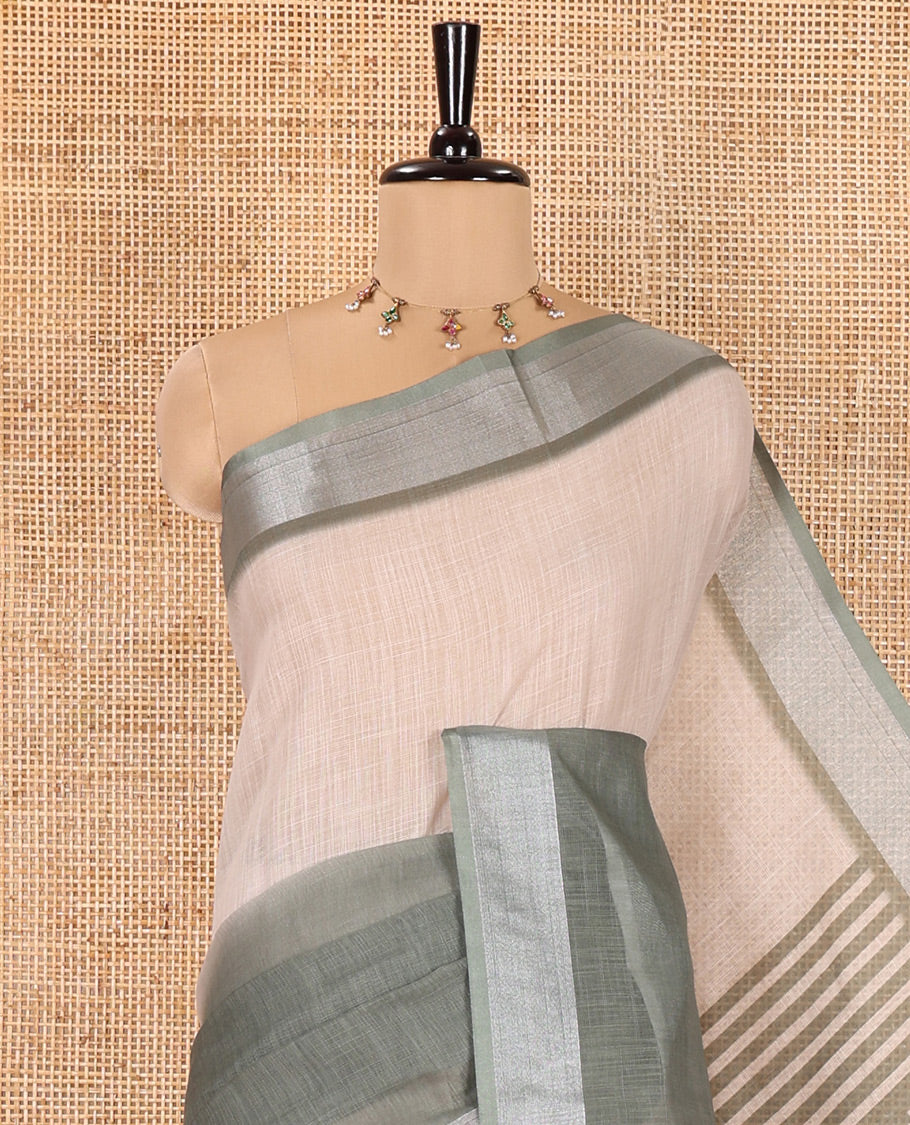 Cream and Green Plain Linen Cotton Saree, Subtly Ombre-Style Dual-Color Dye on Its Body, Subtle Bavanji Zari Border, Pallu Features Rangoli-Style Patterns Print, and Paired with a Polka Dots Printed Blouse