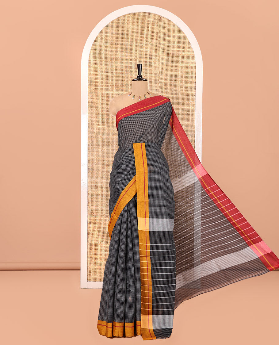 Black and Mustard-Red Chettinad Cotton Saree, Subtly Sparkled with Checked Design on Its Body, Complemented by Contrast Ganga-Jamuna Border, Striped Pallu, and Comes Without a Blouse
