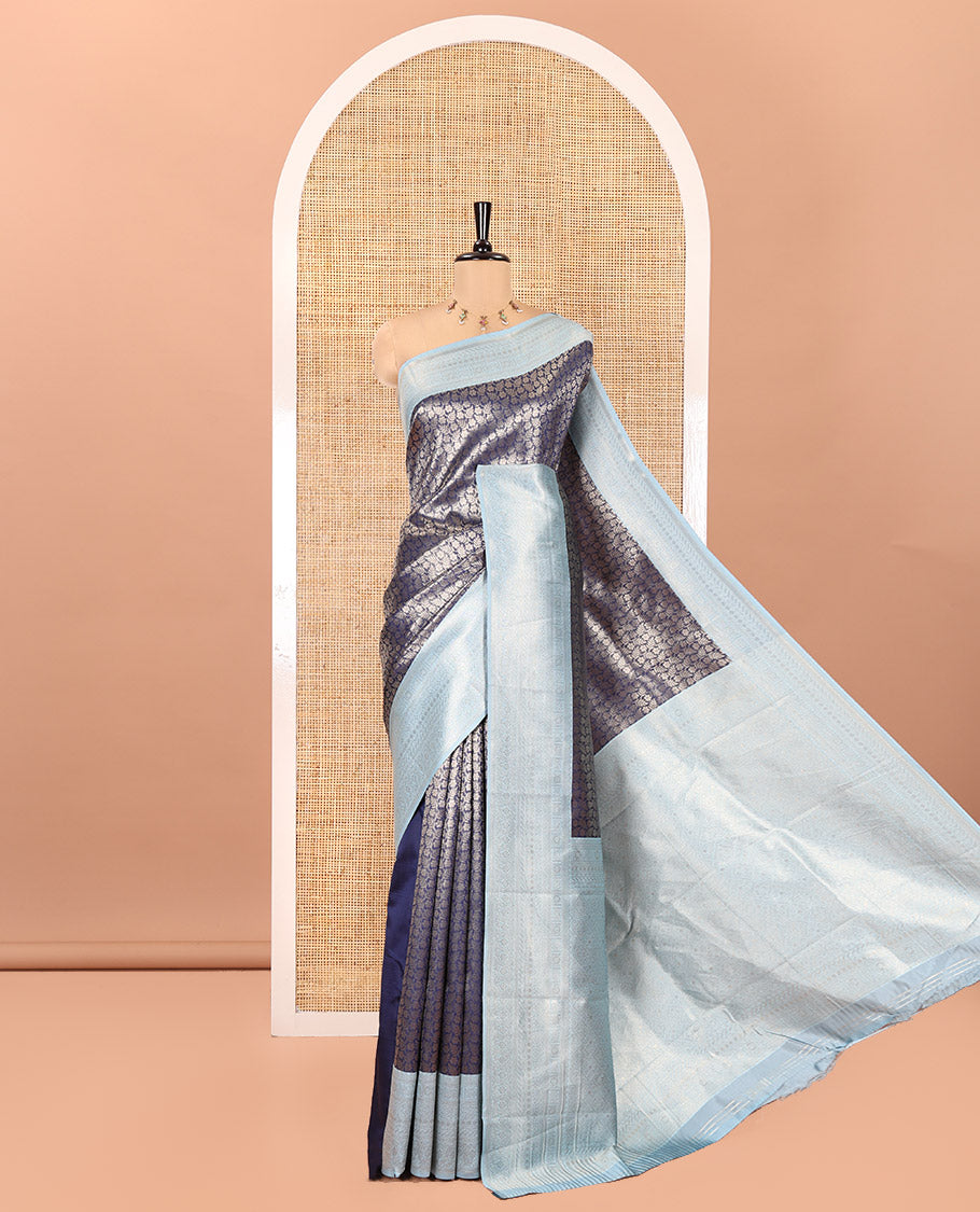 Navy Blue Kanchi Silk Saree, Gleamed Up with Floral-Leaf Jacquard Design on Its Body, Complemented by a Contrast Traditional Zari Design Border, Intricately Designed Pallu, and Paired with a Contrast Blouse