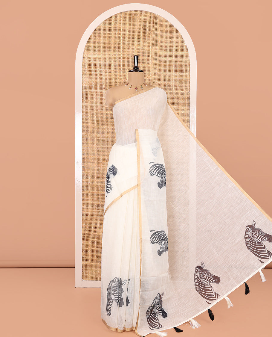 Off-white Linen Cotton Saree, Accentuated with Zebra Motifs Print, A Subtle Piping Border, Zebra Printed Pallu, and Comes with a Contrast Blouse