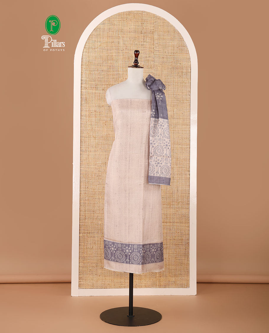 Chikku color semi-tussar material chudidar set, warli motifs top, contrast grey plain bottom & dupatta steeped with warli motifs