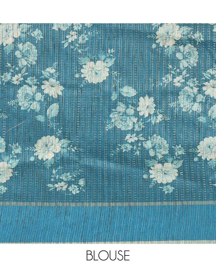 Peacock blue floral printed fancy tussar saree, contrast small zari border, and zari design pallu, and a contrast floral printed blouse