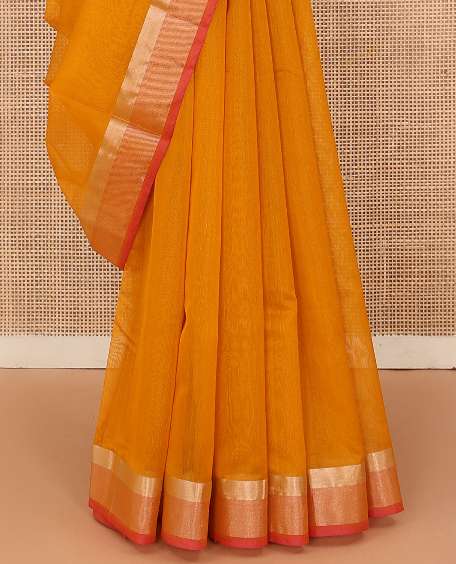 Orange plain silk cotton saree, contrast zari border, and plain pallu