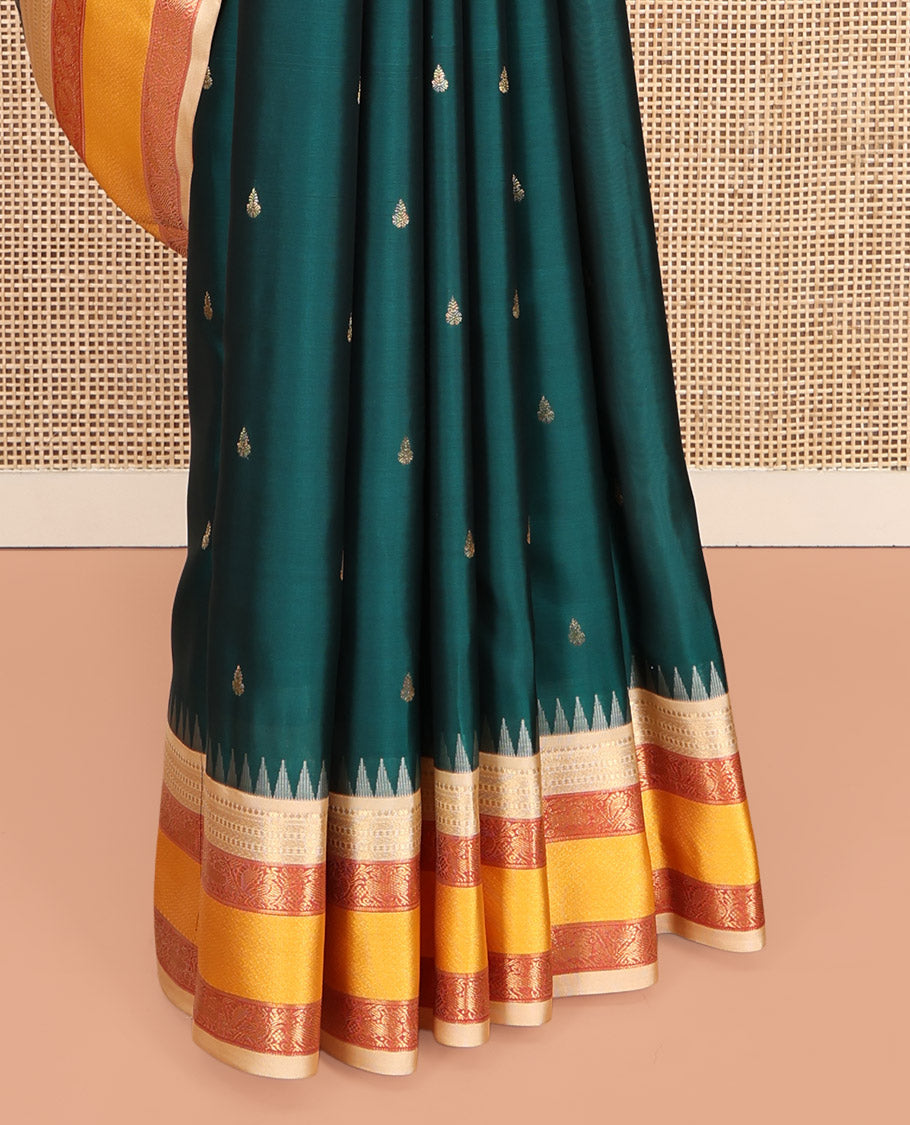 Teal Vasundhara Lite-Silk Mix Saree, Decked Up with Zari Buttas, Contrast Temple Border of Mayil Design, Paiyadi Kattam Pallu, and a Contrast Blouse
