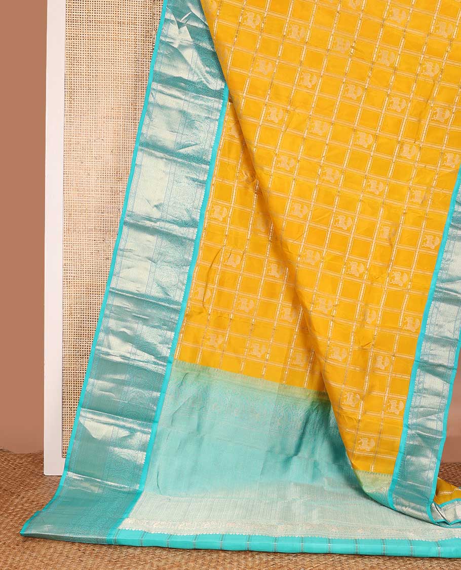 Yellow zari design silk saree, contrast border of arumbu manga, kamalam, Muthu, and mayil kann, and geometric patterns zari woven pallu