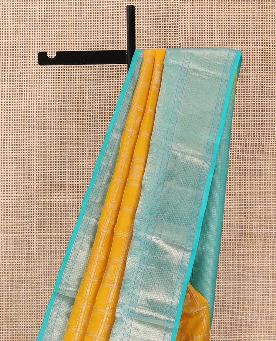 Yellow zari design silk saree, contrast border of arumbu manga, kamalam, Muthu, and mayil kann, and geometric patterns zari woven pallu