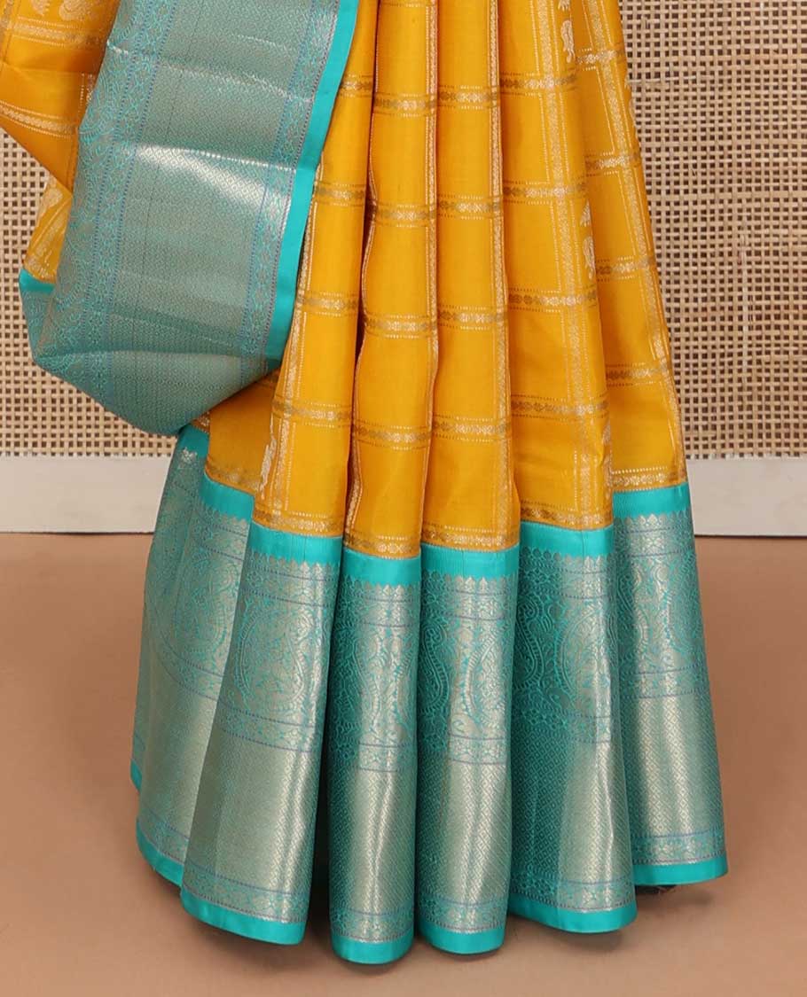 Yellow zari design silk saree, contrast border of arumbu manga, kamalam, Muthu, and mayil kann, and geometric patterns zari woven pallu