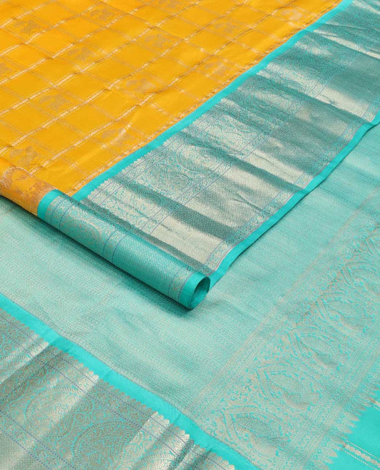Yellow zari design silk saree, contrast border of arumbu manga, kamalam, Muthu, and mayil kann, and geometric patterns zari woven pallu