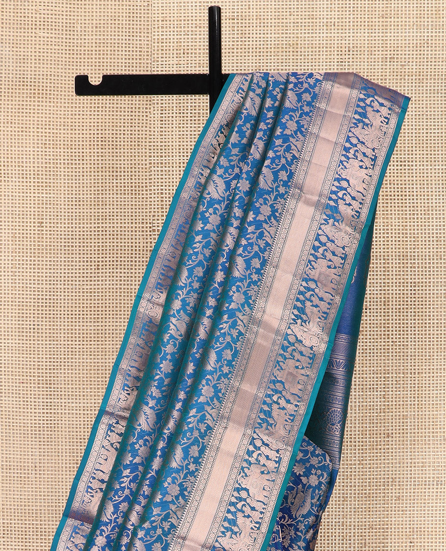 Blue Kanchipuram Silk Saree Elegantly Framed with Jacquard Design, Highlighted by Zari Border of Rekku, Muthu, Kamalam, and Prince in Palanquin Designs, Beautifully Bedecked Pallu, and Paired with a Matching Blouse
