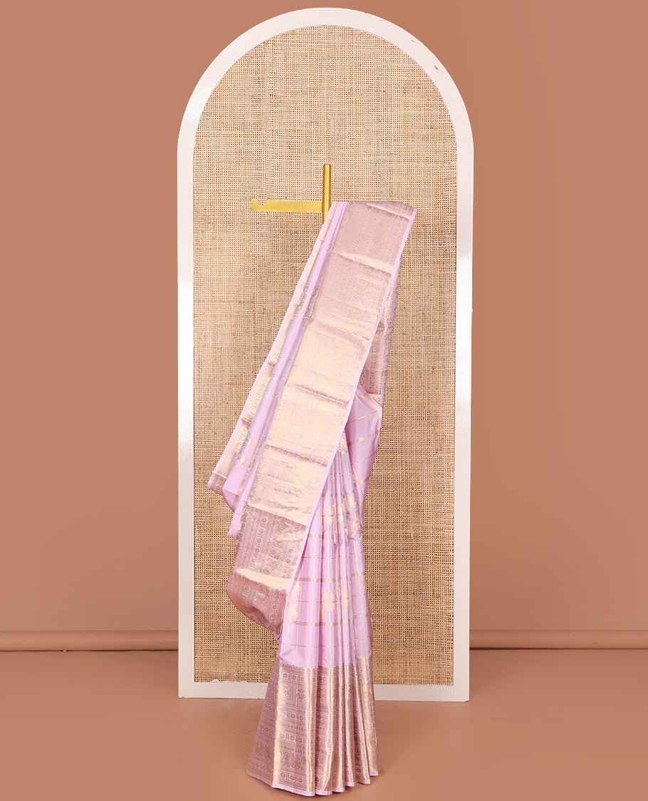 Pink Vasundhara Silk Saree Elevated with Zari Designs All Over Its Body, Complemented by Zari Border of Rekku, Kathir, Star Vanki, Iruthalai Pakshi, and Mayil Designs, a Grand Pallu, and Paired with a Matching Blouse