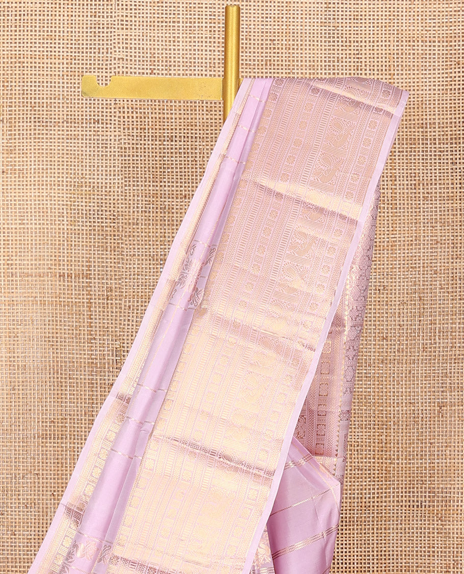 Pink Vasundhara Silk Saree Elevated with Zari Designs All Over Its Body, Complemented by Zari Border of Rekku, Kathir, Star Vanki, Iruthalai Pakshi, and Mayil Designs, a Grand Pallu, and Paired with a Matching Blouse